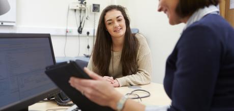 Female clinician and patient in a general practice consulting room