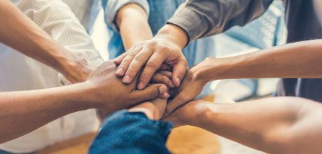 Team with hands together