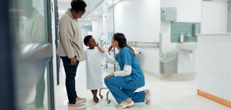 Hospital staff with child patient