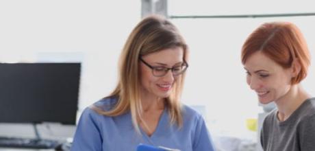 Doctor with clipboard and patient