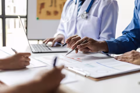 Doctor at desk with patient