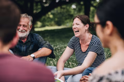 Group of people chatting in a park