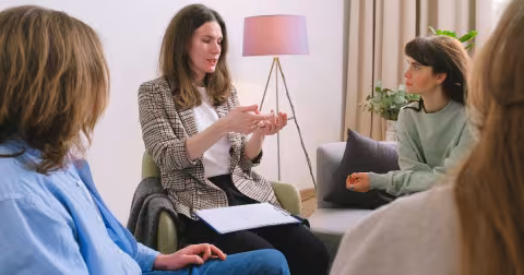 A group of women talking together during a group discussion