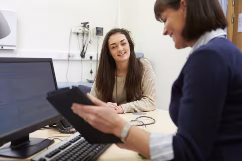 Female clinician and patient in a general practice consulting room