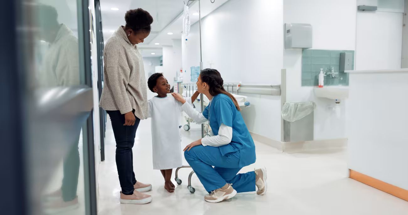 Hospital staff with child patient