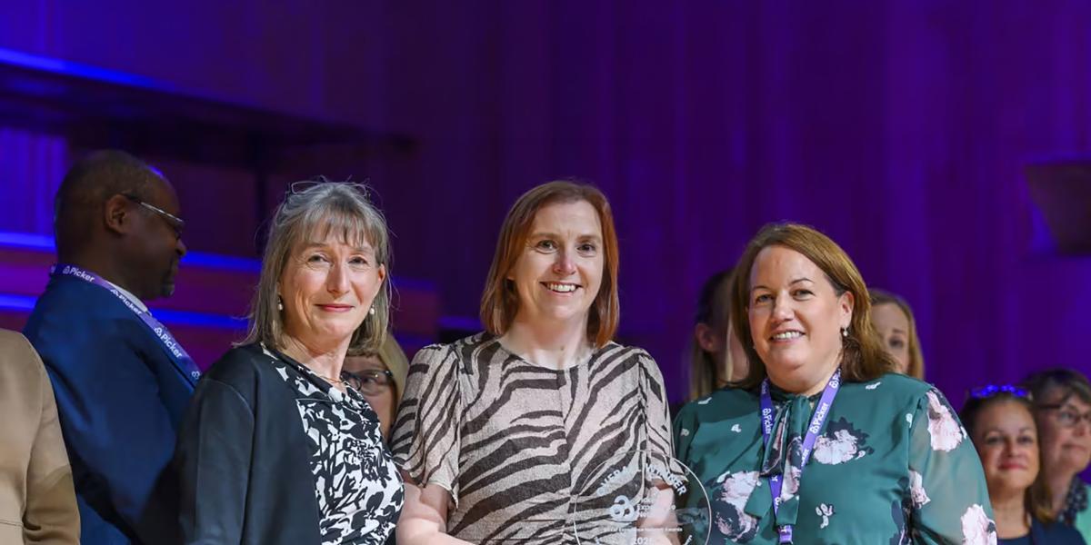 Group of women collecting award