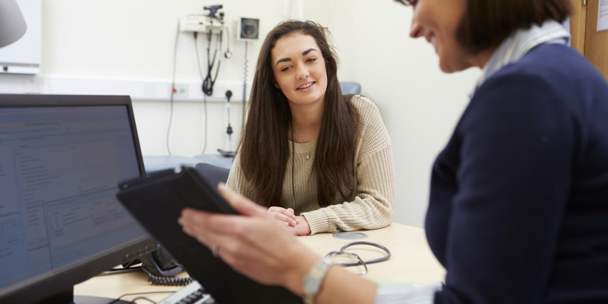 Female clinician and patient in a general practice consulting room
