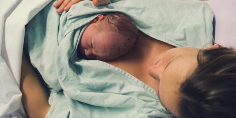 New born baby on mother's chest in hospital