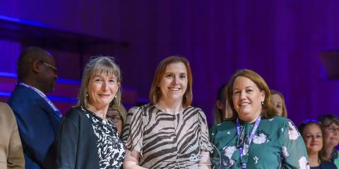 Group of women collecting award