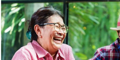 Asian lady in cafe with friends